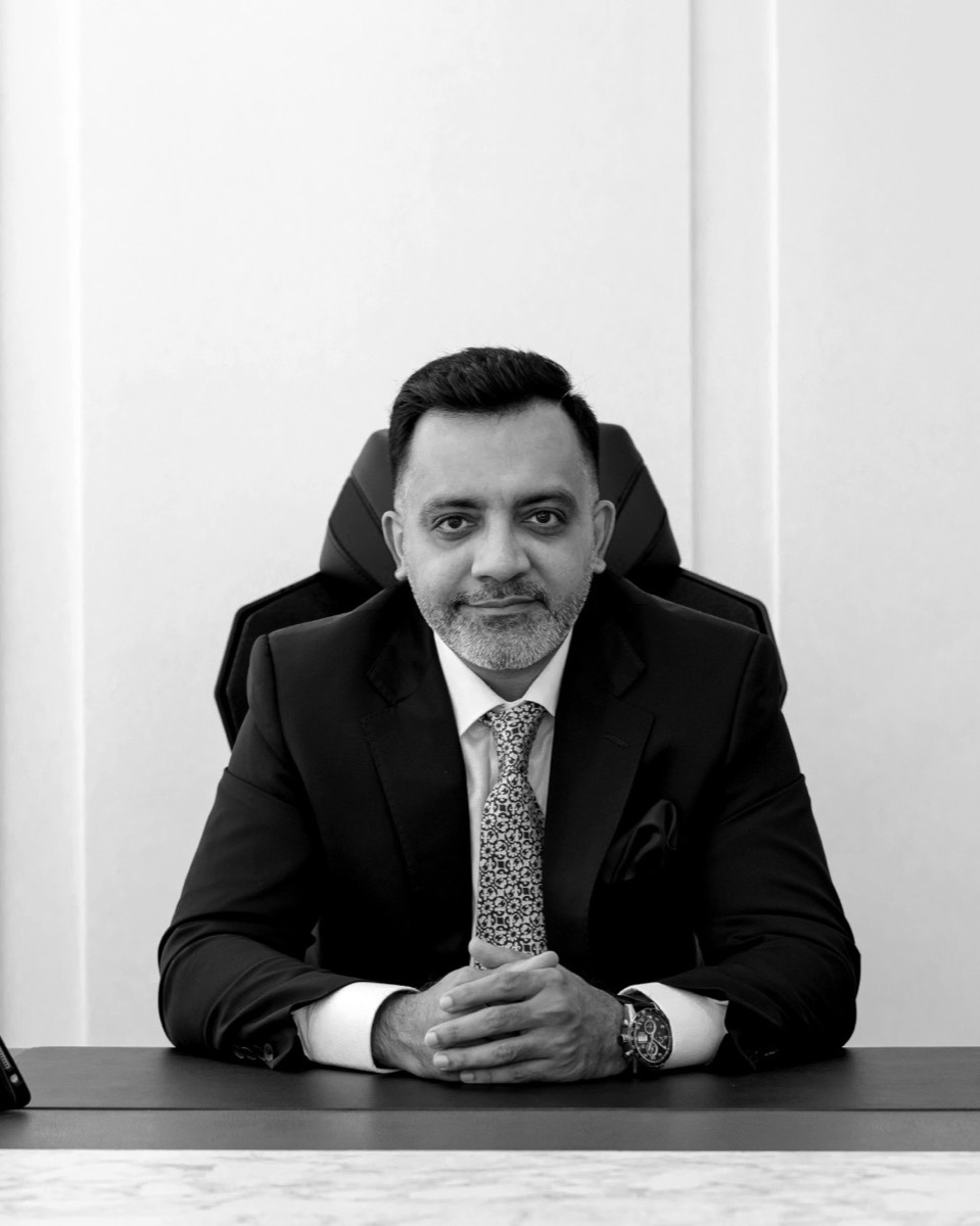 Bimal Lulla, founder of AXXA, at his desk.